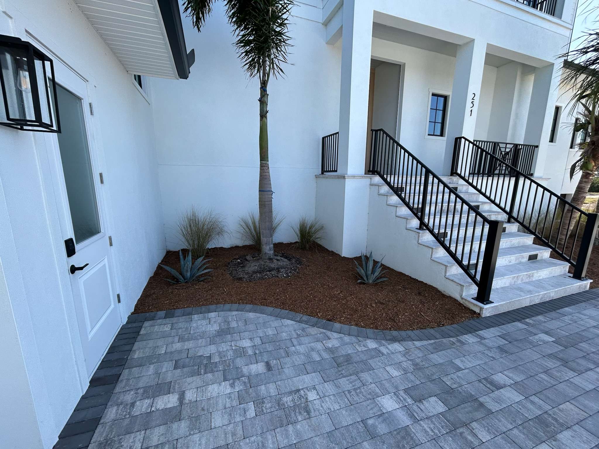 Custom landscaping design options around a newly constructed home.