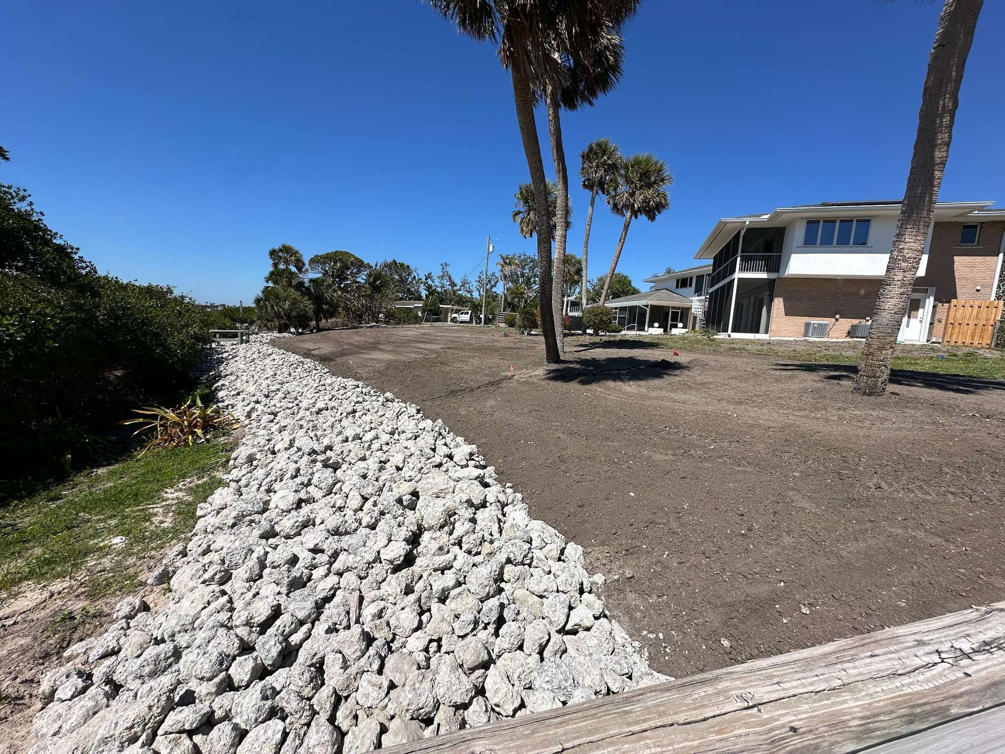 Yard drainage with rip rap and proper soil grading