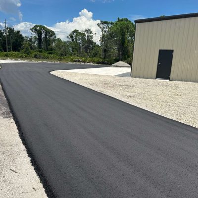 Recently asphalt paved driveway.