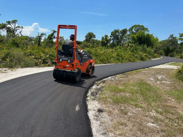IMG_1119 Road roller smoothing out asphalt paving.
