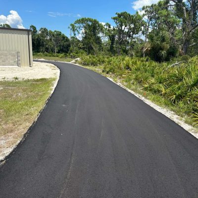 Recently asphalt paved driveway.