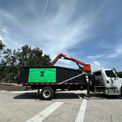 Liberty Tree and Land Services grapple truck.