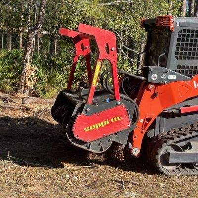 Forestry mulching machine clearing out some trees.