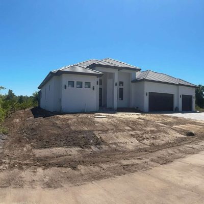 Stucco grading done with excavation equipment to for painting stucco.